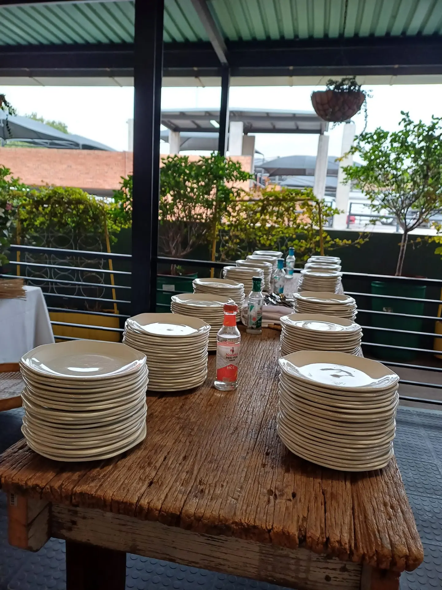 Stacks of plates ready for service on the catering table