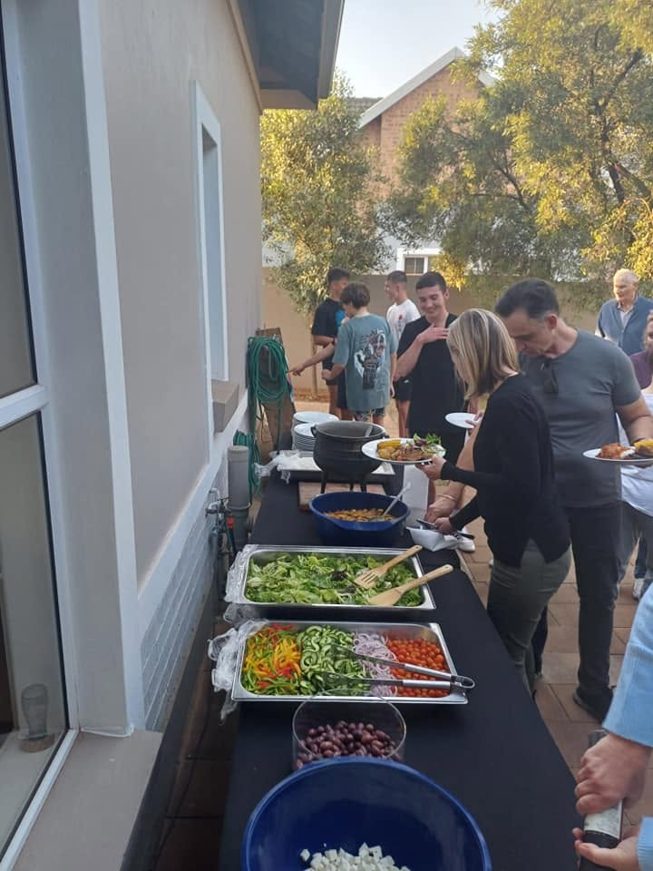 Guests at the salad and sides buffet line
