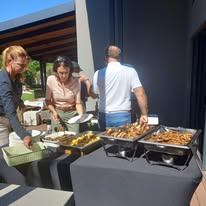 Guests at the chafing dish buffet line