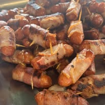 Close-up of grilled, browned meat pieces on skewers