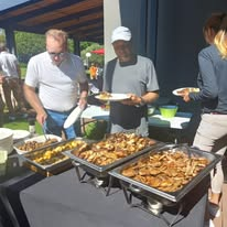 Our team serving guests from the hot buffet